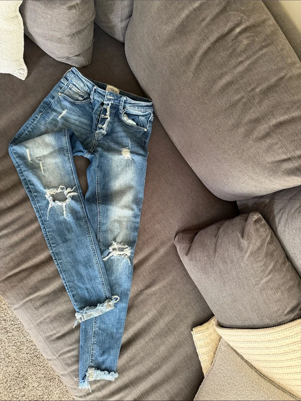 Ripped Light Blue Skinny Jeans with Button-Fly